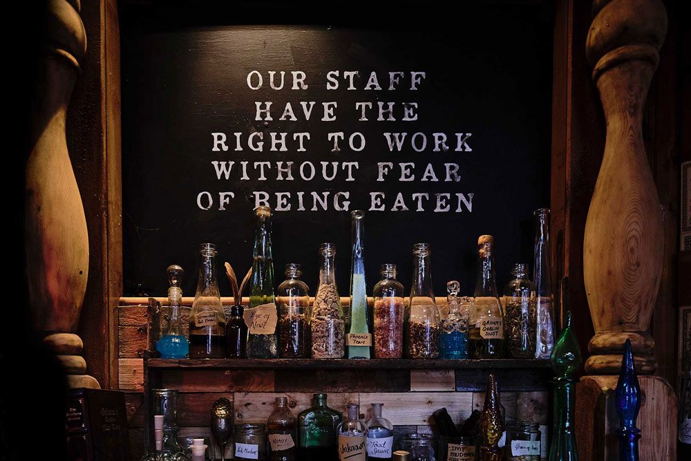 Sign inside Grimm & Co that says Our Staff have the right to work without fear of being eaten